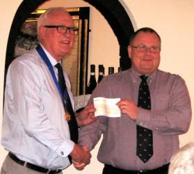 RNLI's Terry Sheppard receives a cheque from PP Alec Banyard